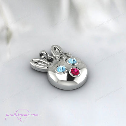 Handcrafted sterling silver bunny necklace with Aquamarine, Ruby, and Onyx, accented with 14k gold for a luxurious touch.