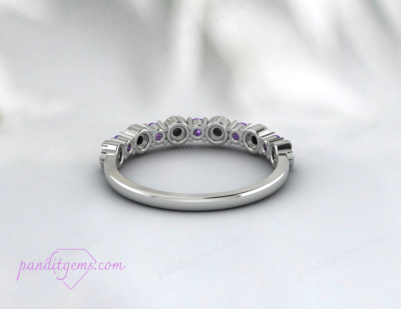 "Handcrafted wedding band with natural opal and amethyst set in sterling silver, personalized engraving available."
