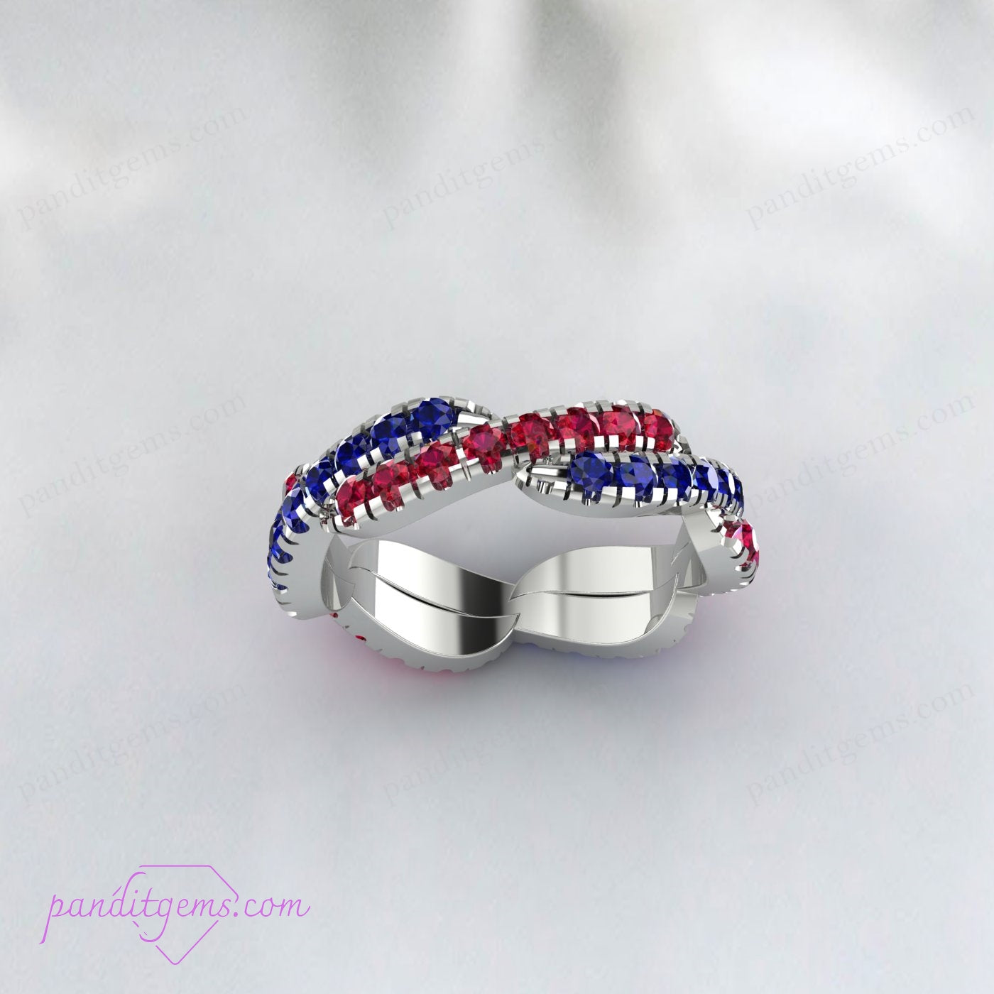 Lab-grown Blue Sapphire and Ruby gemstones in a sterling silver twisted band, symbolizing eternal love.