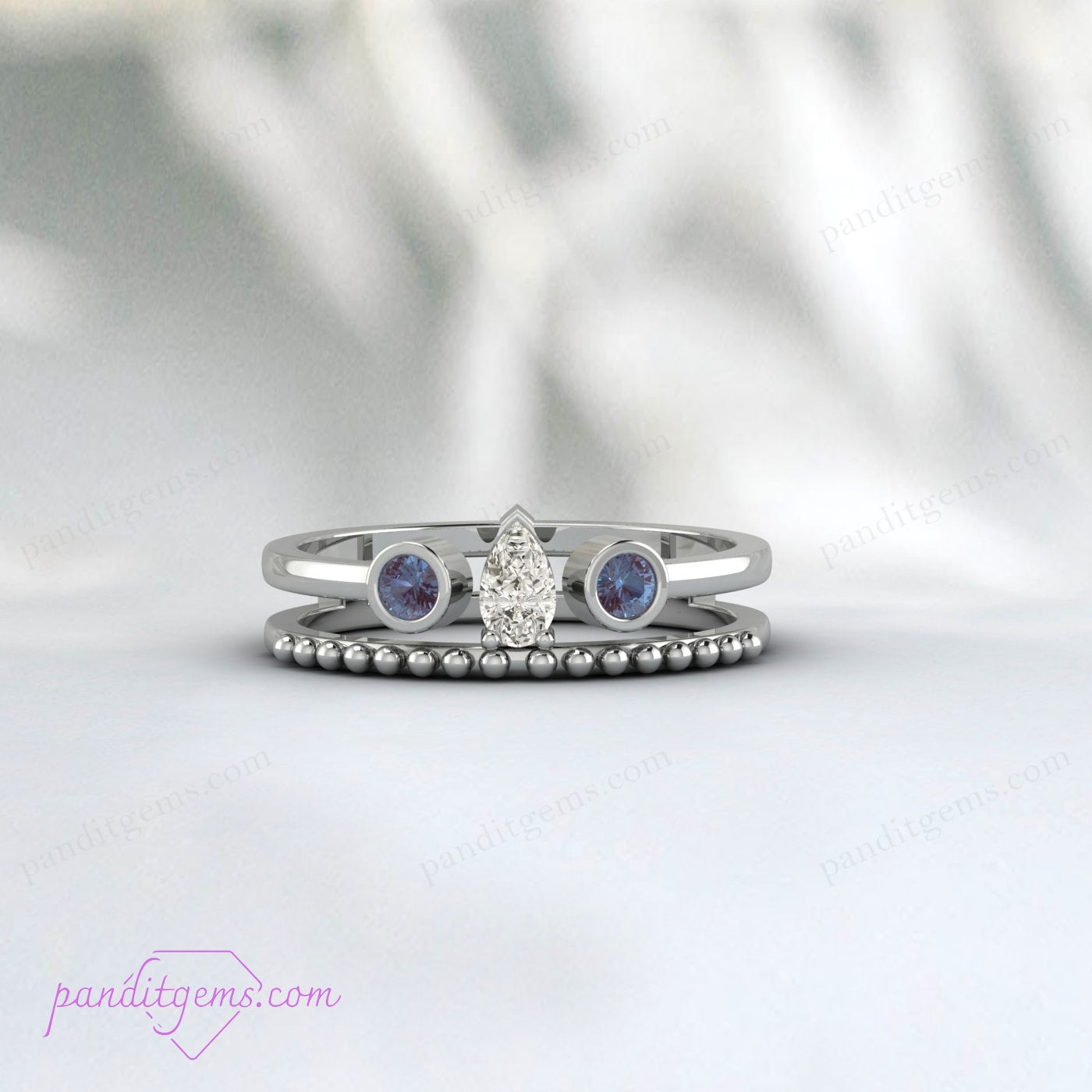 Luxurious Beaded Shank Ring with Alexandrite and Pear Diamond Details.