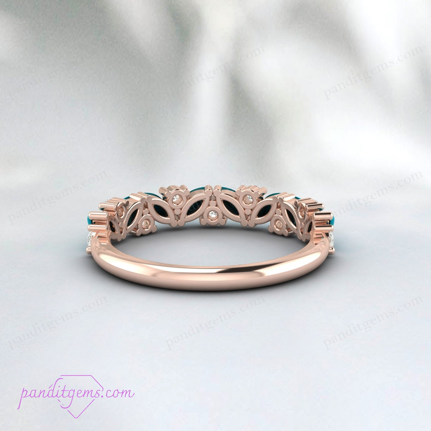 A ring featuring a marquise cut turquoise stone and cubic zirconia, set in 925 sterling silver