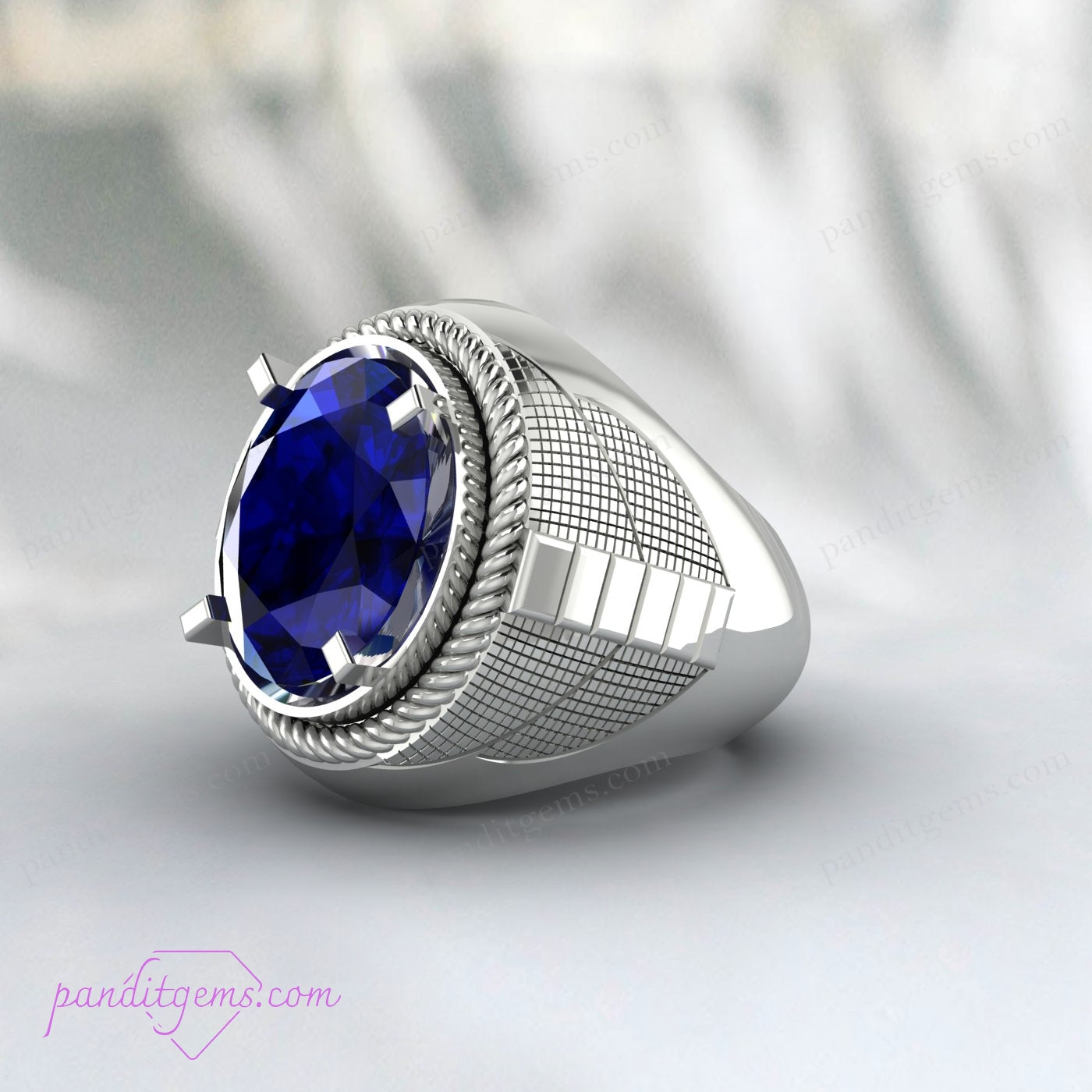 Men's sterling silver ring with deep blue sapphire gemstone, symbolizing wisdom and protection.