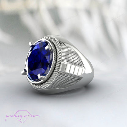 Men's sterling silver ring with deep blue sapphire gemstone, symbolizing wisdom and protection.