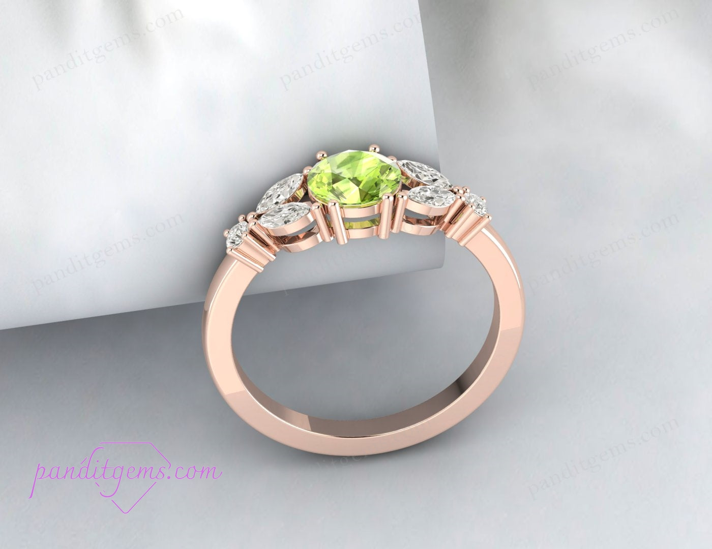 A minimalist silver ring featuring a round peridot and diamond accents.