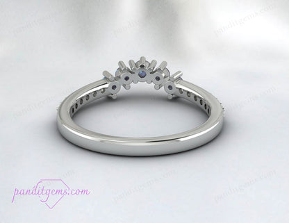 An anniversary band with Alexandrite and moissanite set in sterling silver.