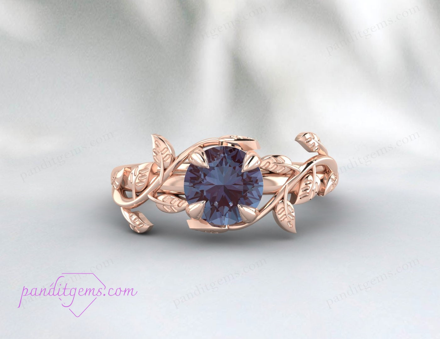 An elegant engagement ring featuring a vine leaf pattern and a round Alexandrite stone.