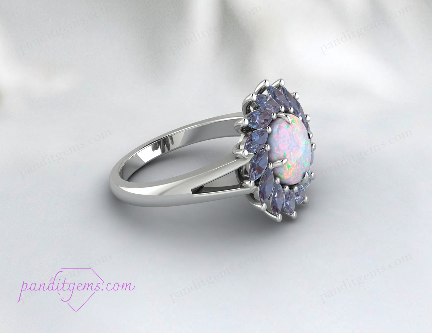 Opal and Alexandrite birthstone ring featuring a round opal center and marquise Alexandrite stones.