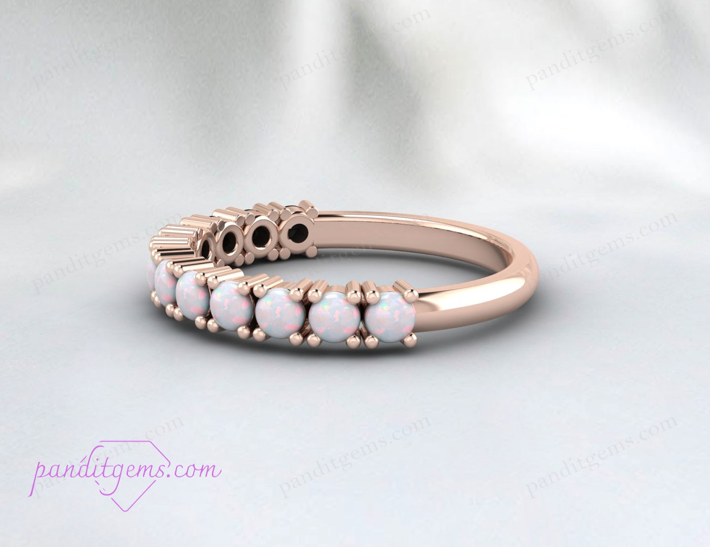 Opal eternity ring symbolizing emotional balance and creativity for October birthdays.
