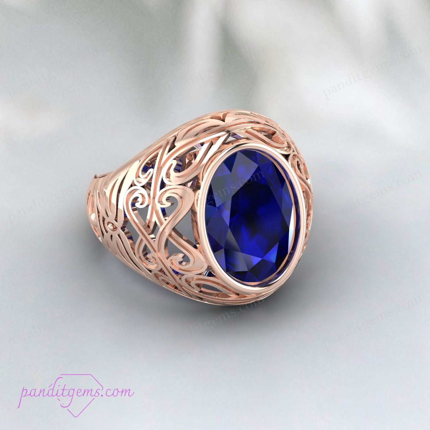 Oval Cut Blue Sapphire Ring with vintage filigree in sterling silver, capturing the elegance of the gemstone and craftsmanship.