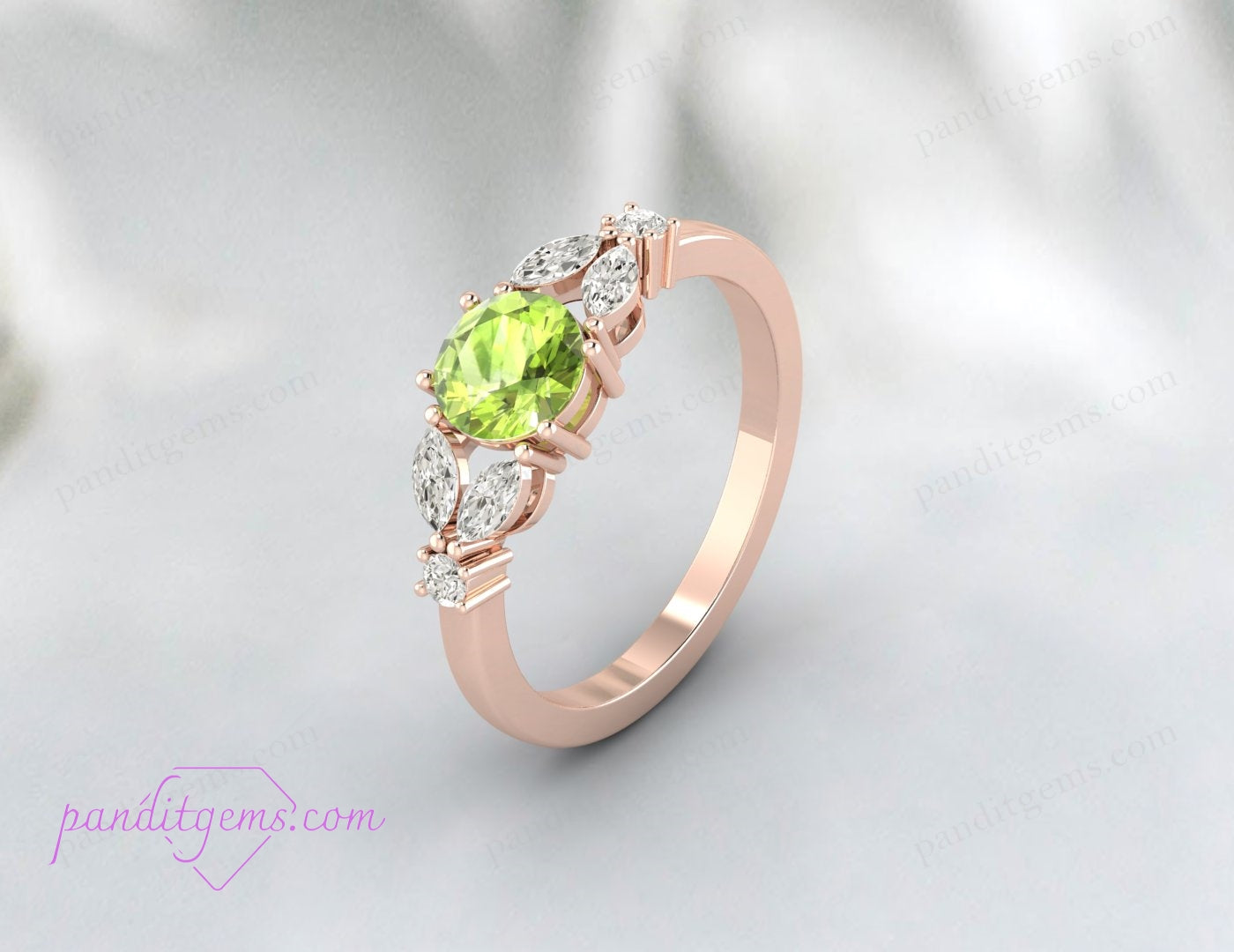 The Round Peridot and Marquis Diamond Leaf Ring displayed elegantly on a ring stand.