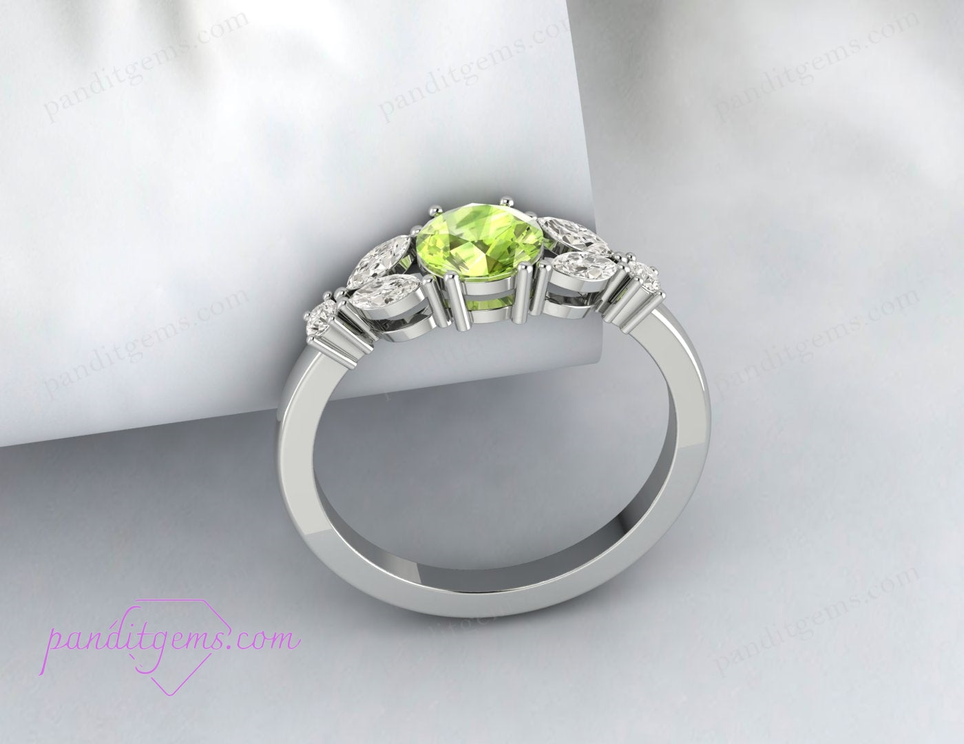 A beautiful silver ring with a round peridot and diamond accents.