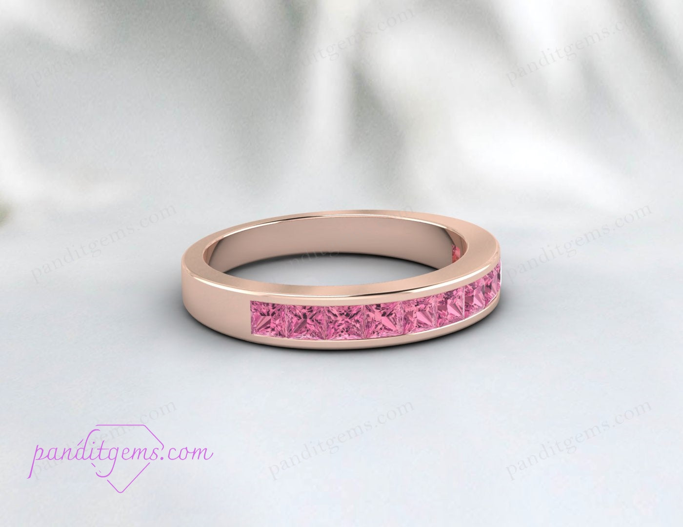 Princess cut pink tourmaline engagement ring in sterling silver.
