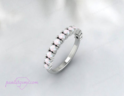 Rose gold opal engagement ring showcasing the October birthstone's natural brilliance.

