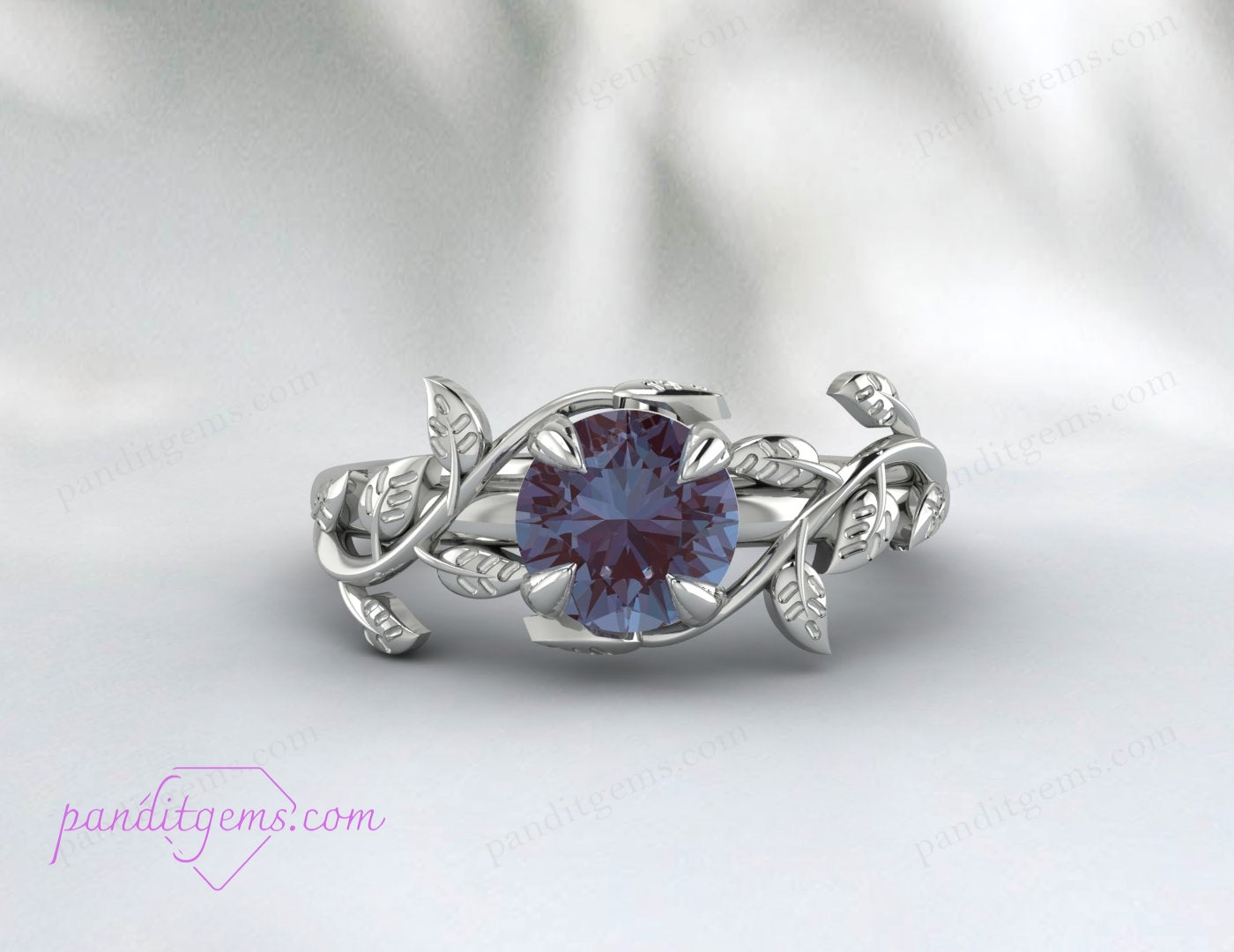 A sterling silver ring with rose gold plating and a round Alexandrite stone.