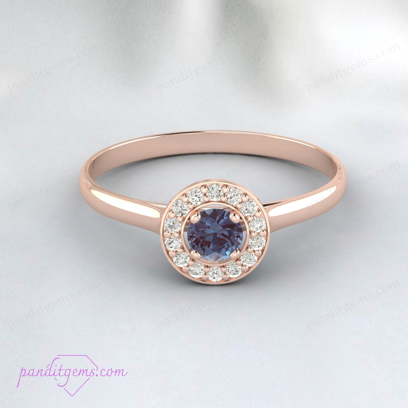 Round-shaped Alexandrite set in a rose gold halo engagement ring.