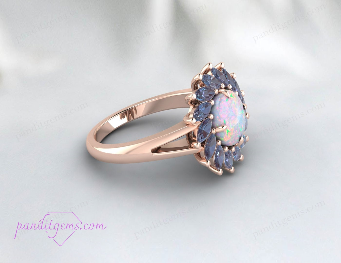 Round opal gemstone set in sterling silver with sparkling Alexandrite stones for a unique October birthstone ring.