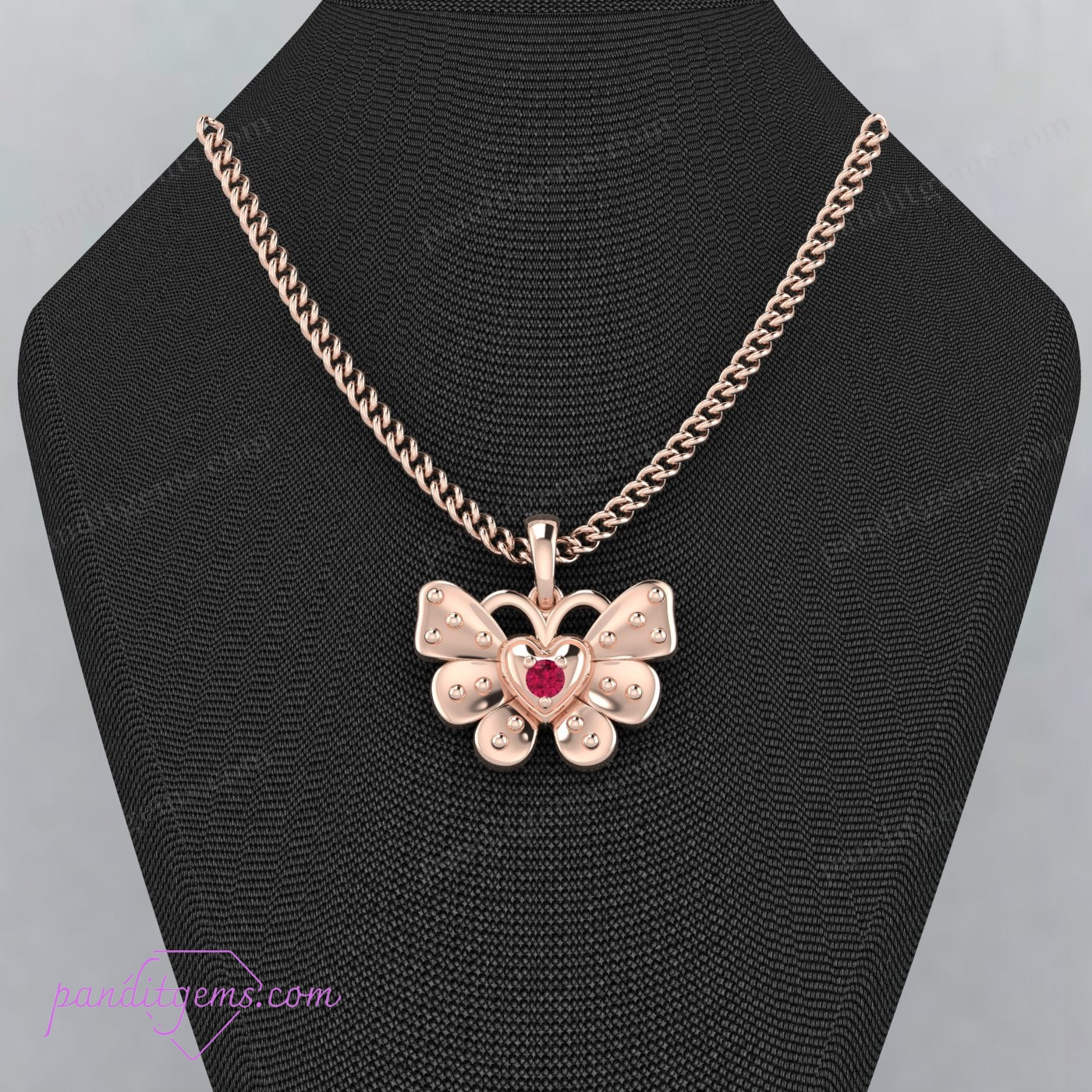 Ruby-adorned butterfly pendant necklace in sterling silver.