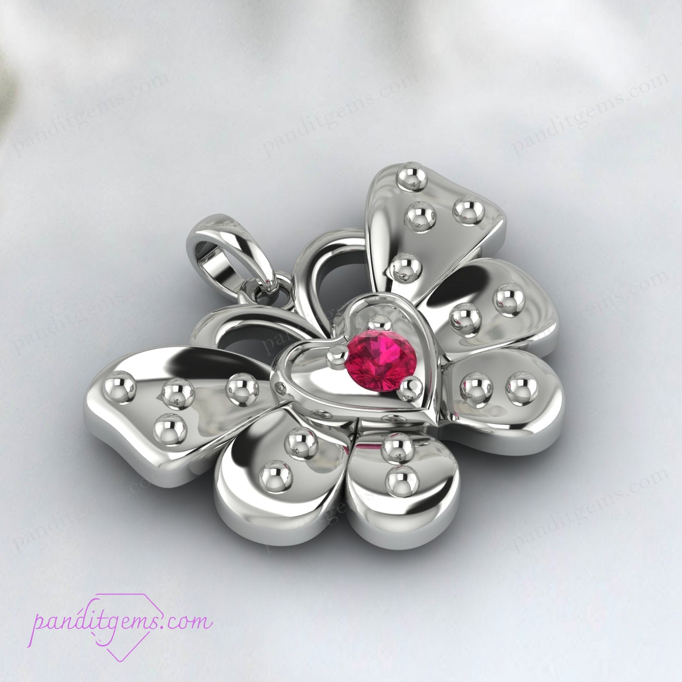 Ruby-studded butterfly pendant in sterling silver.