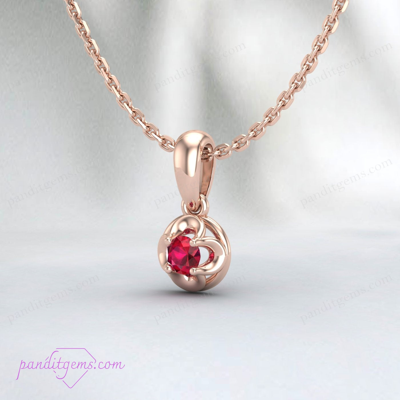 The Ruby Solitaire Necklace presented in a luxurious gift box.