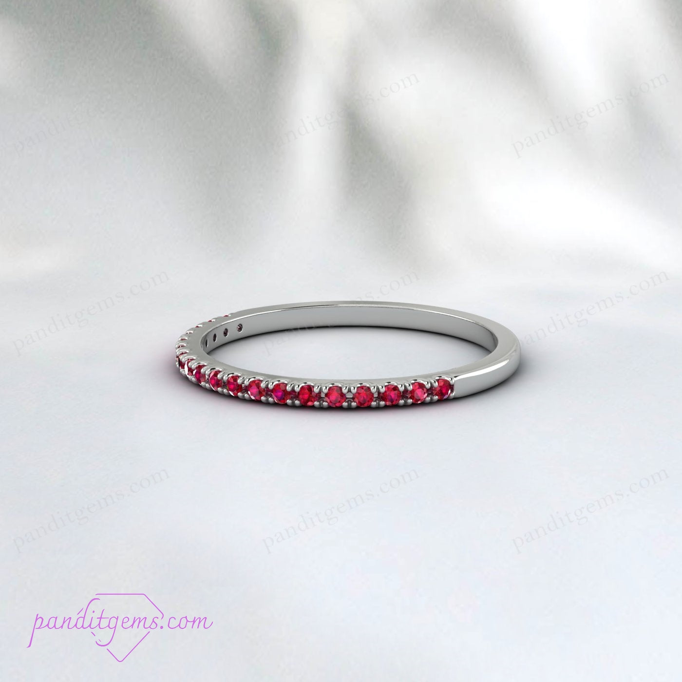 The ruby wedding band displayed in a luxurious gift box.