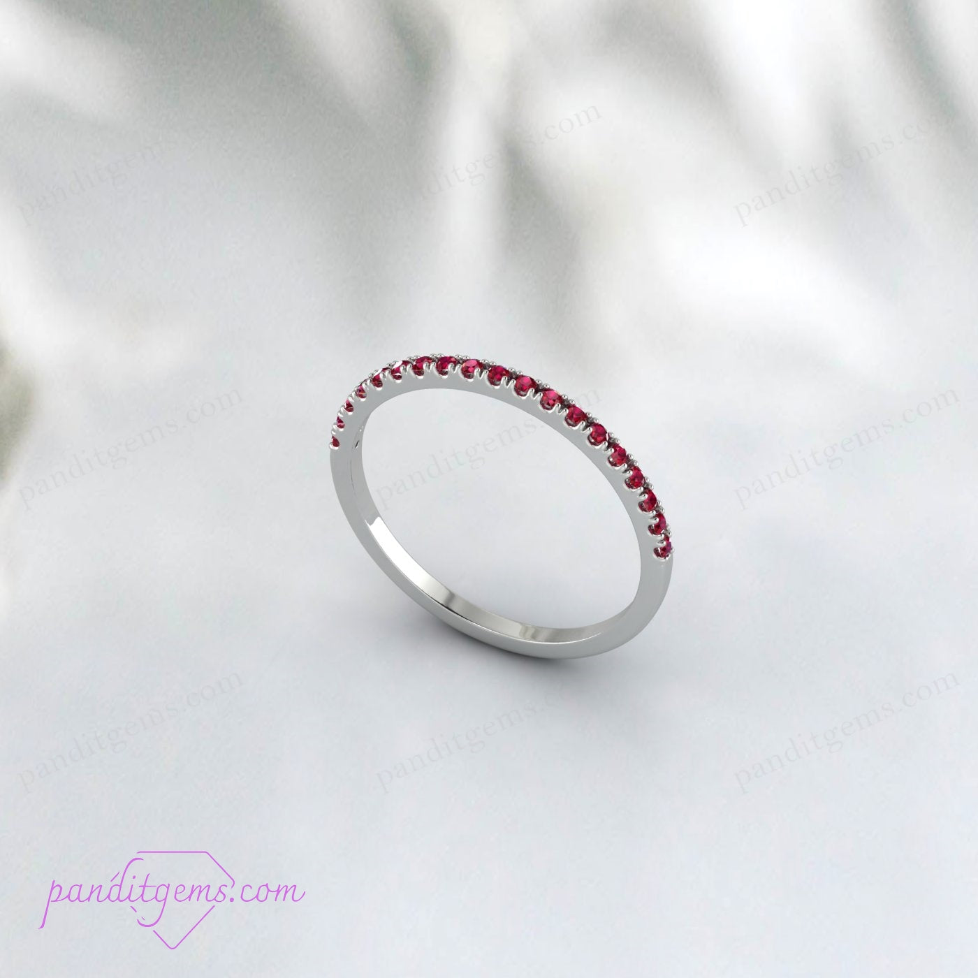 The ruby wedding band shining in natural light.