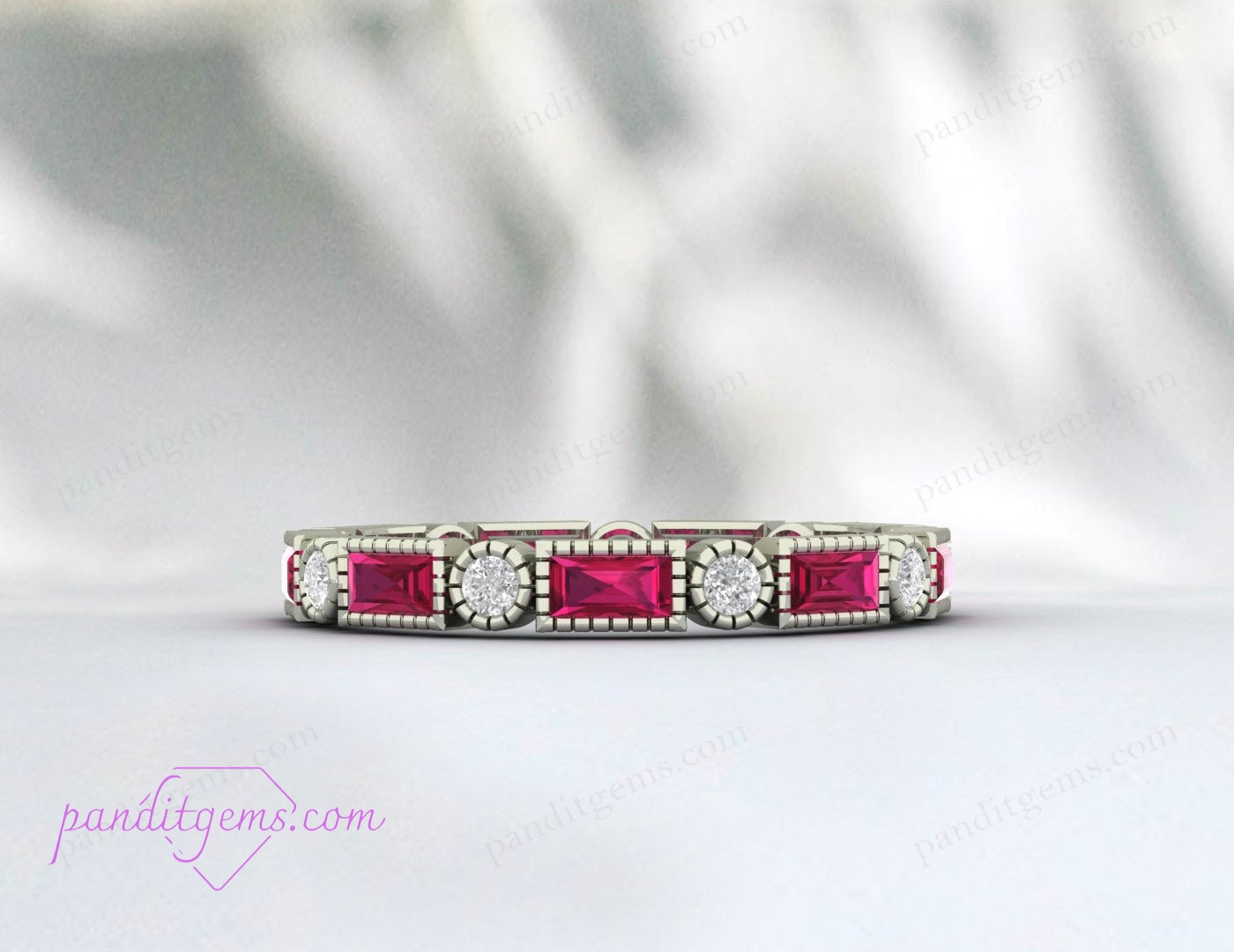 Ruby and diamond engagement ring with baguette and round gemstones, crafted in sterling silver.