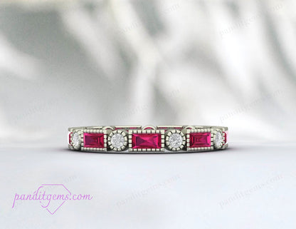Ruby and diamond engagement ring with baguette and round gemstones, crafted in sterling silver.