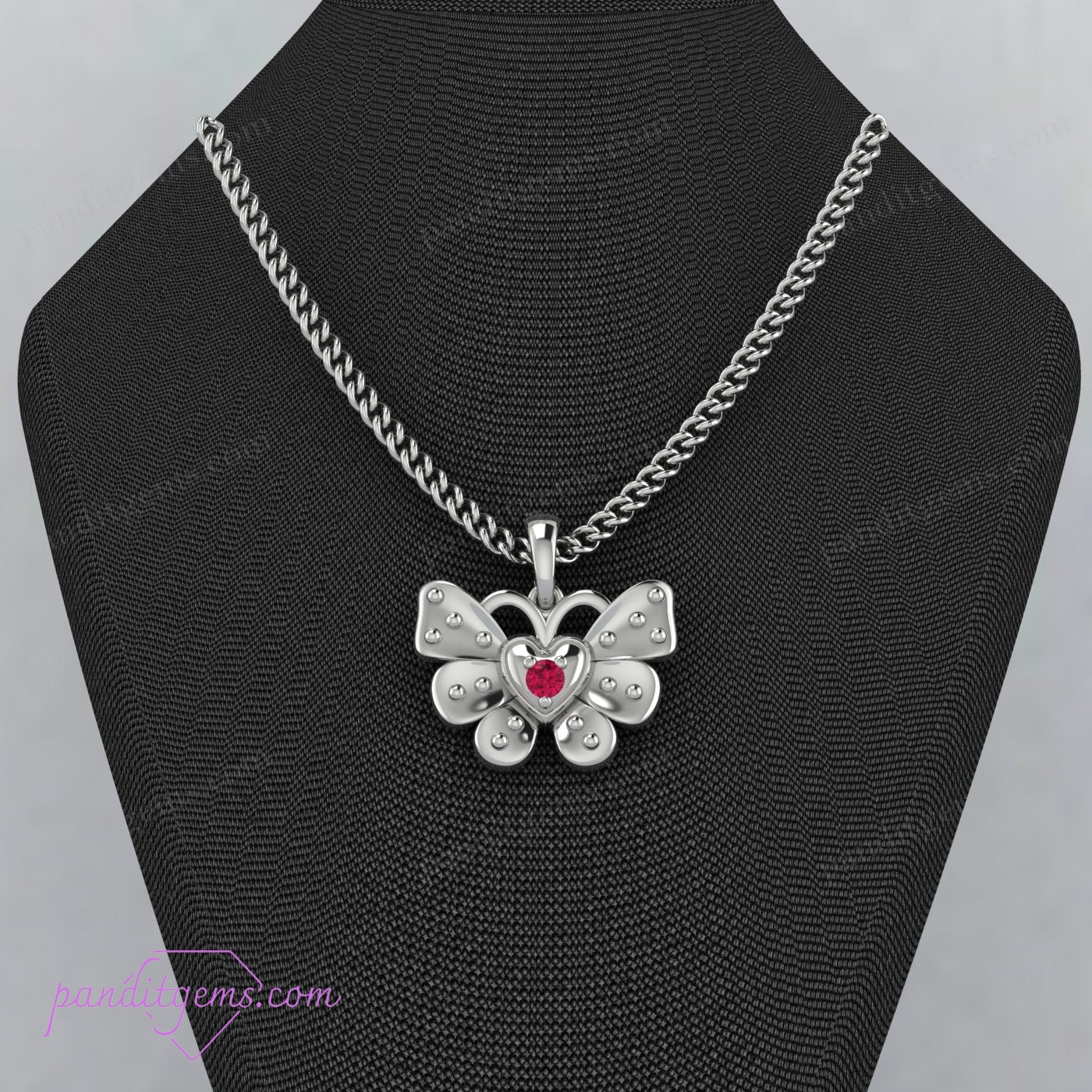 Ruby and silver butterfly charm on a delicate chain.
