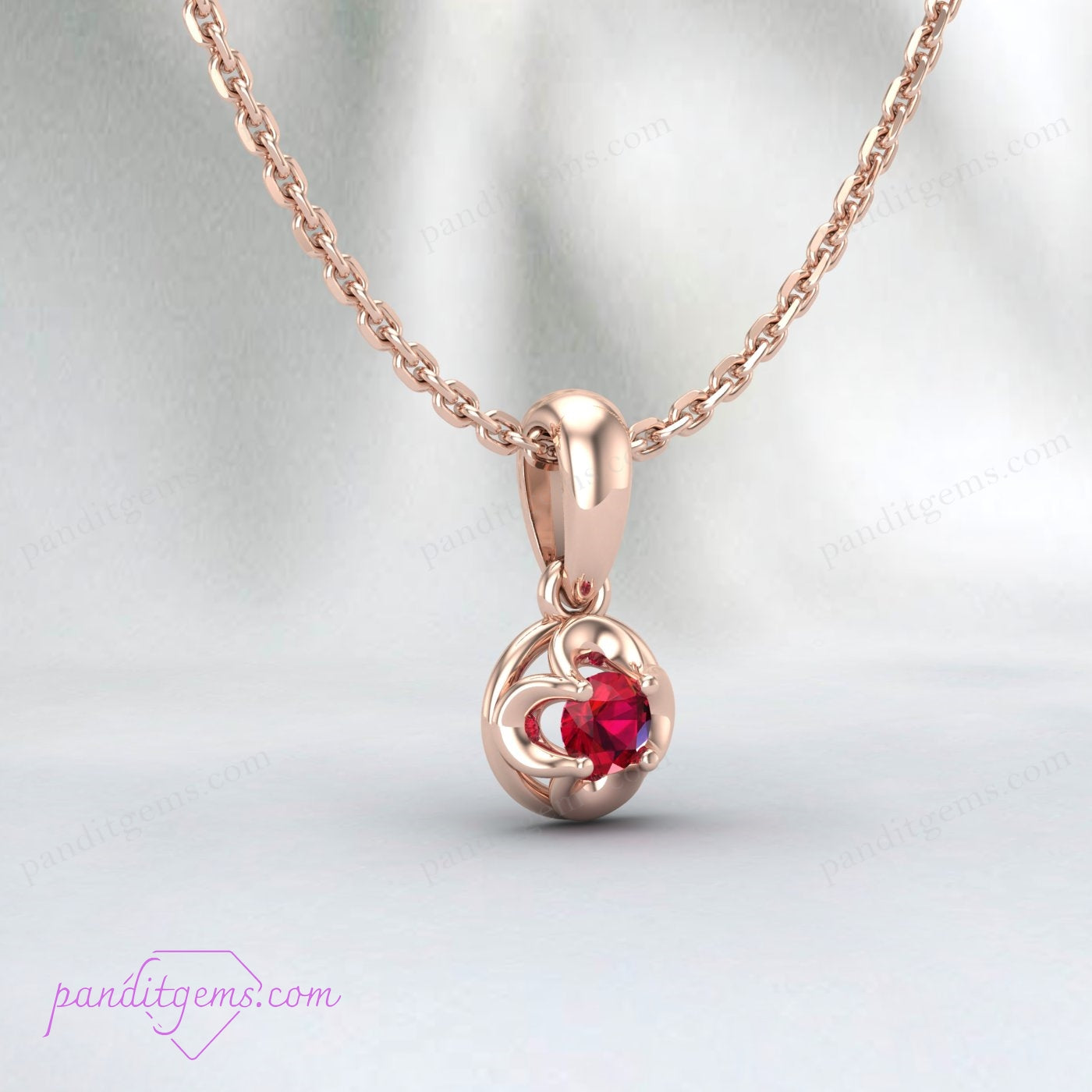 Side view of the ruby pendant showcasing the prong setting in 18K gold filled metal.