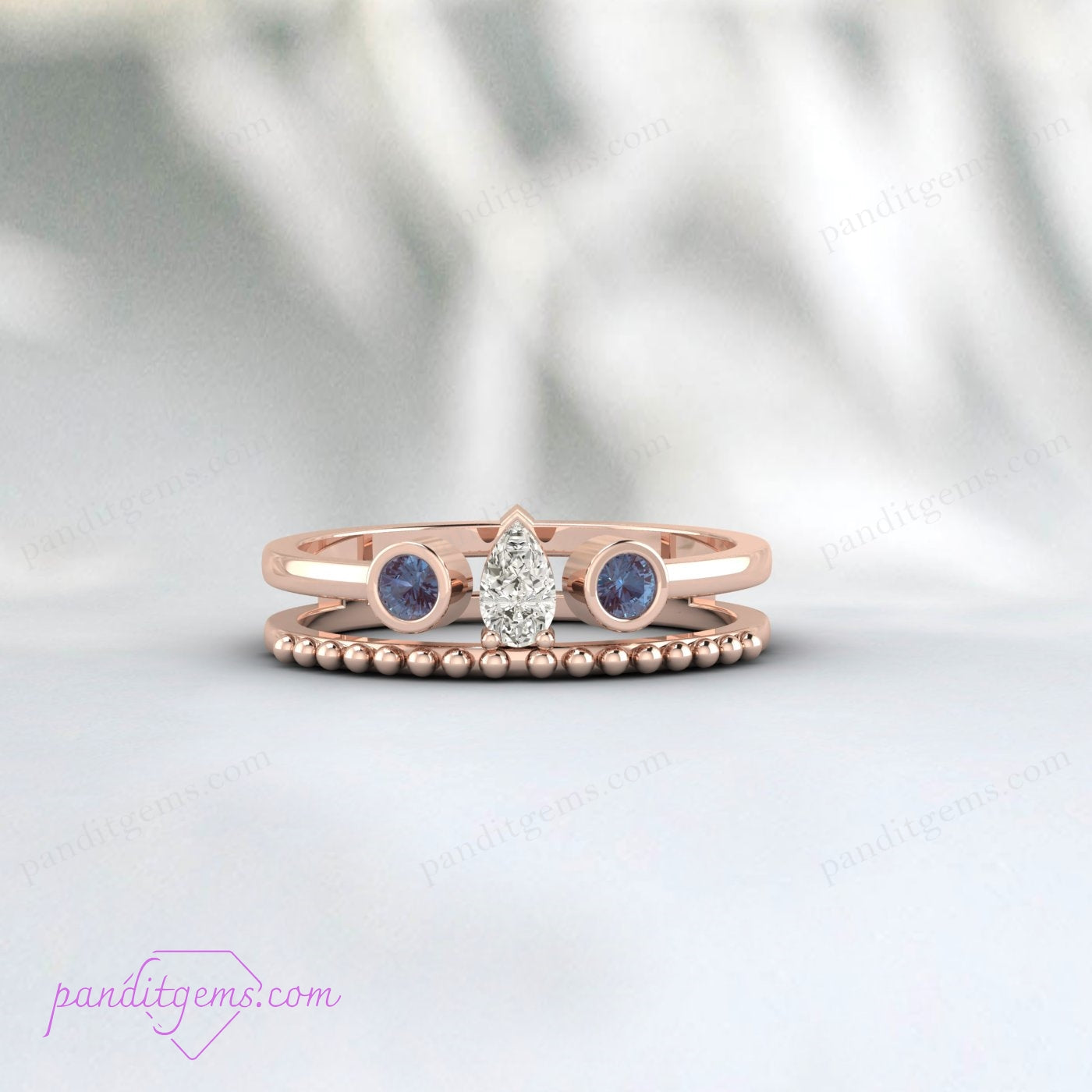 Side view of Alexandrite and Pear Diamond Bridal Ring Enhancer in Yellow Gold.