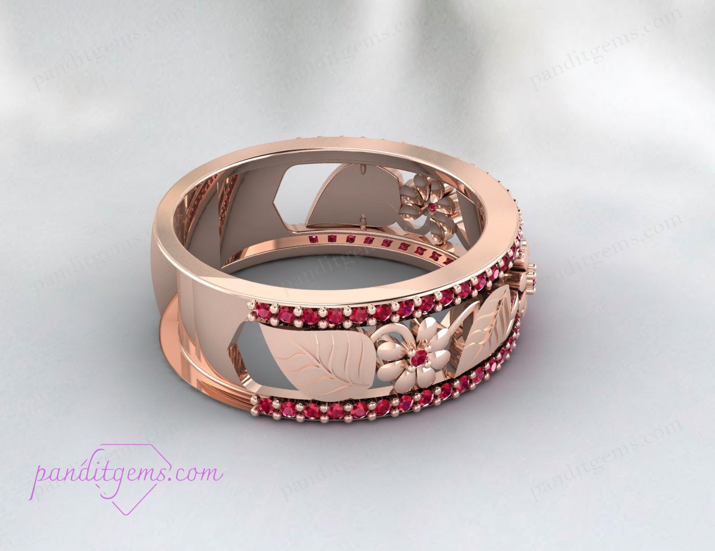 A side view of the wedding band showcasing the delicate leaf patterns and the elegant ruby setting.