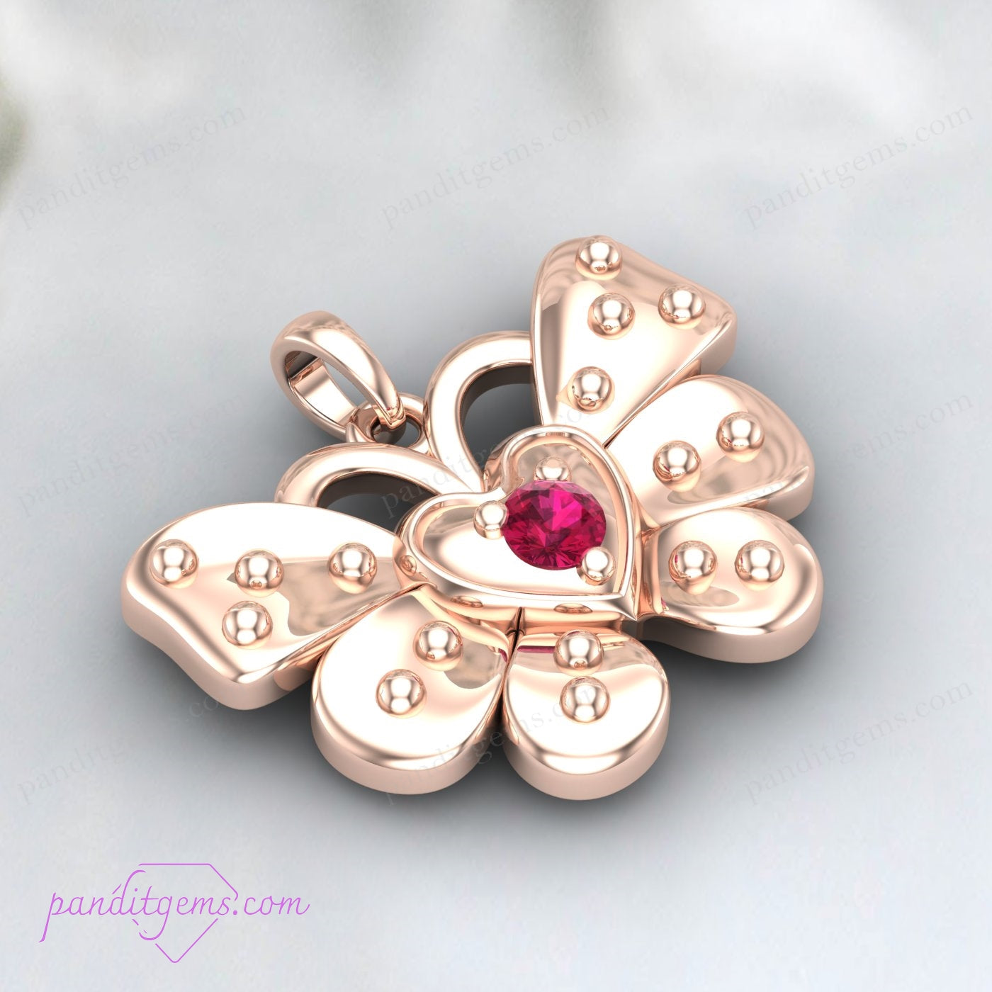 Side view of the ruby butterfly pendant in sterling silver.