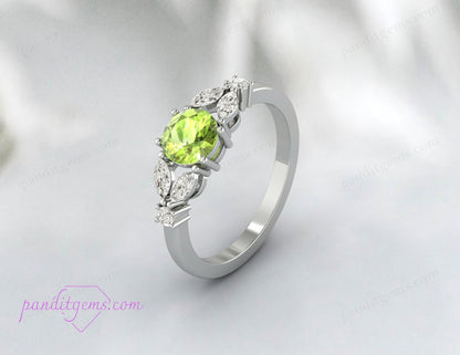 The Round Peridot and Diamond Leaf Ring designed for stacking with other rings.