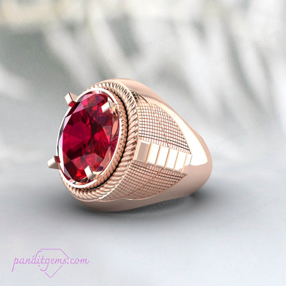 Antique signet ring in sterling silver featuring a vibrant ruby gemstone.