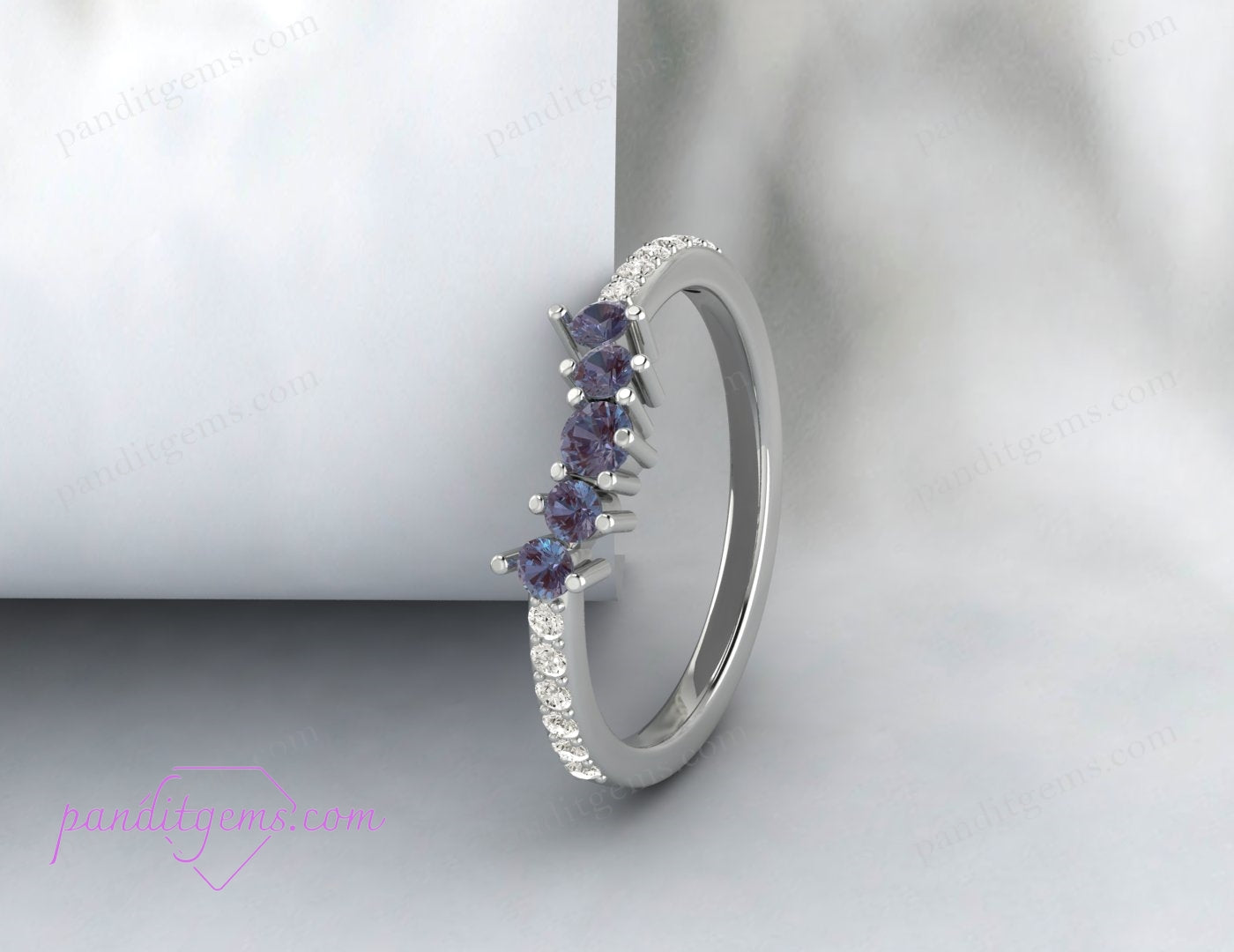 A promise ring crafted from sterling silver with a round Alexandrite gemstone.