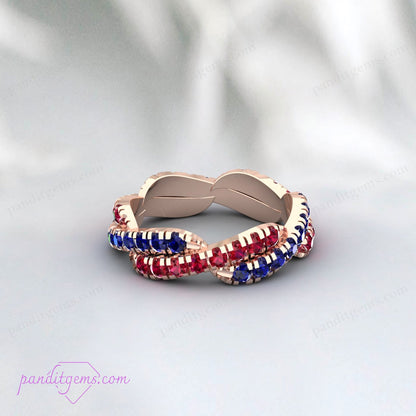 Sterling Silver Blue Sapphire and Ruby Ring with infinity twist design, a meaningful birthstone ring for September and July.