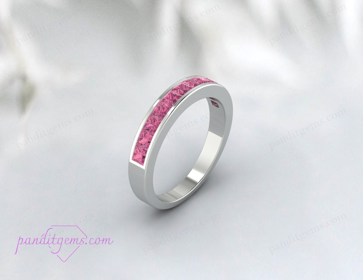 Sterling silver band with pink gemstones for special occasions.
