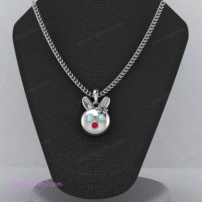 Sterling silver rabbit necklace with Aquamarine, Ruby, and Onyx stones, symbolizing luck and fortune.
