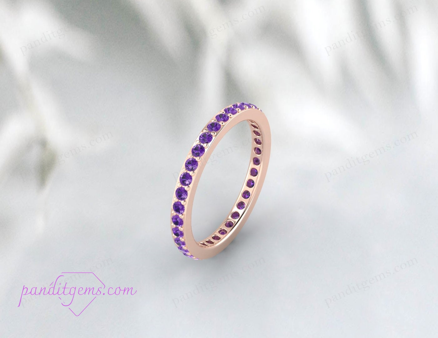 Thin eternity band featuring round amethyst stones in sterling silver. A stunning engagement or wedding ring with a February birthstone.