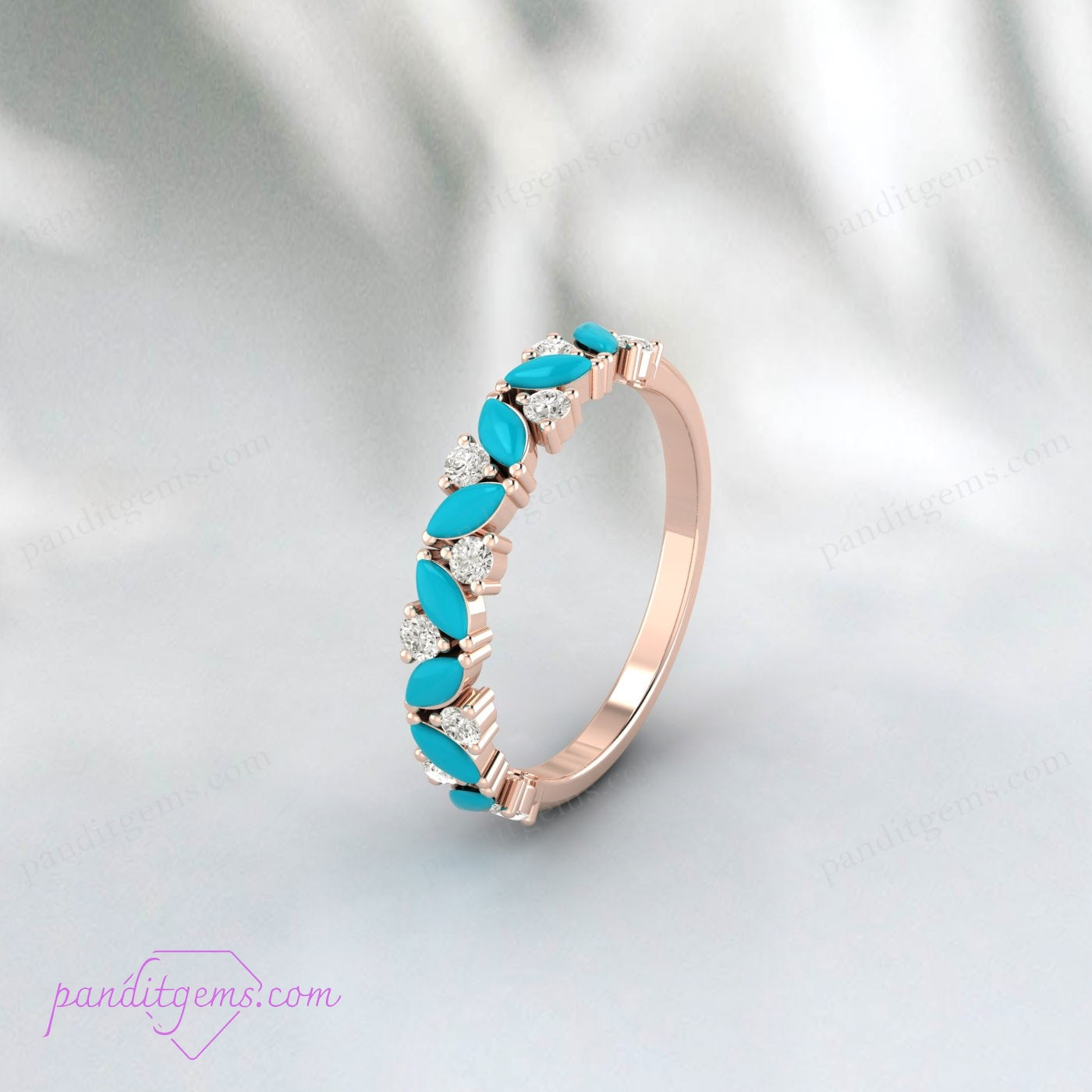 A turquoise engagement ring with white cubic zirconia stones, set in sterling silver
