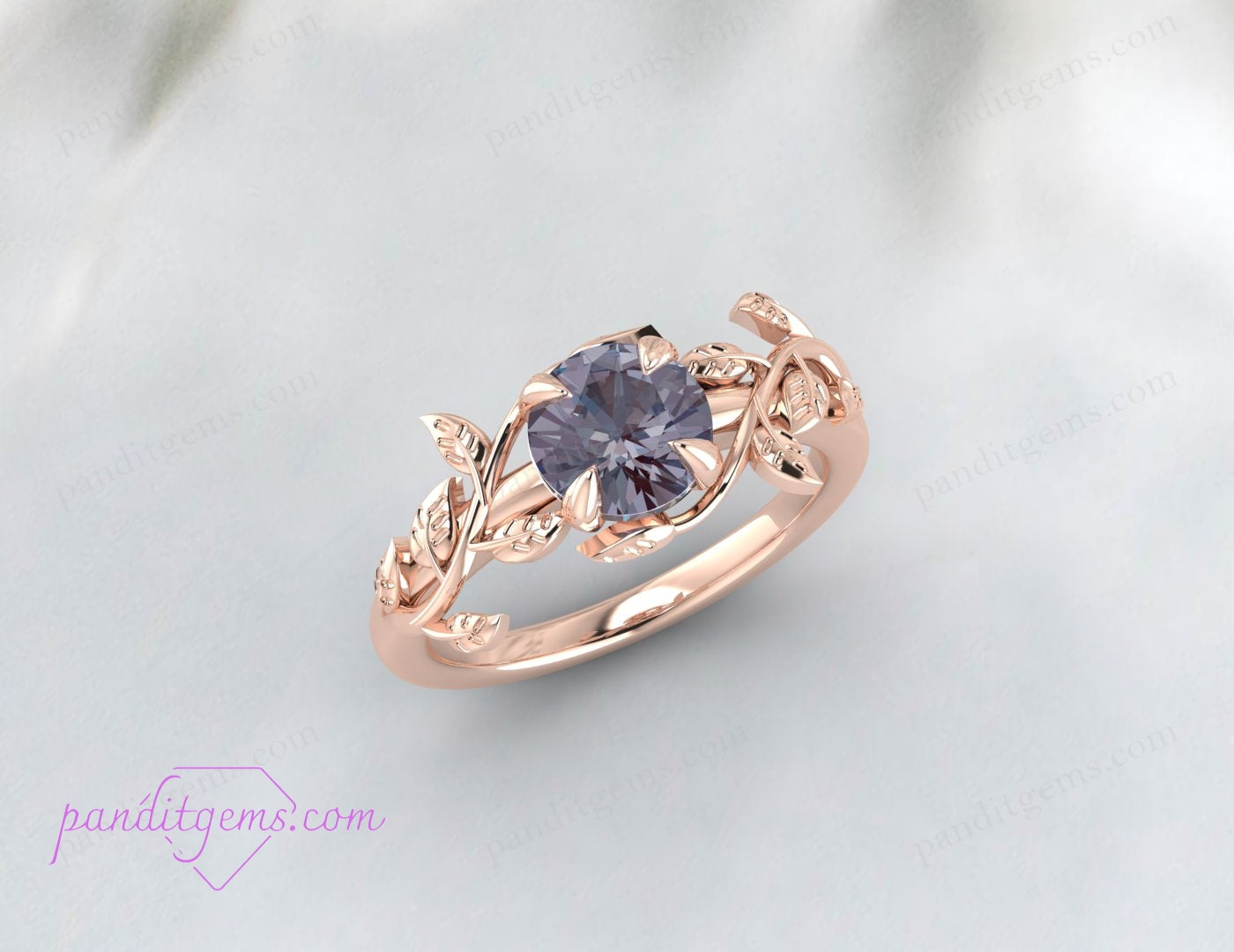 A rose gold-plated ring with a nature-inspired vine leaf pattern and Alexandrite.