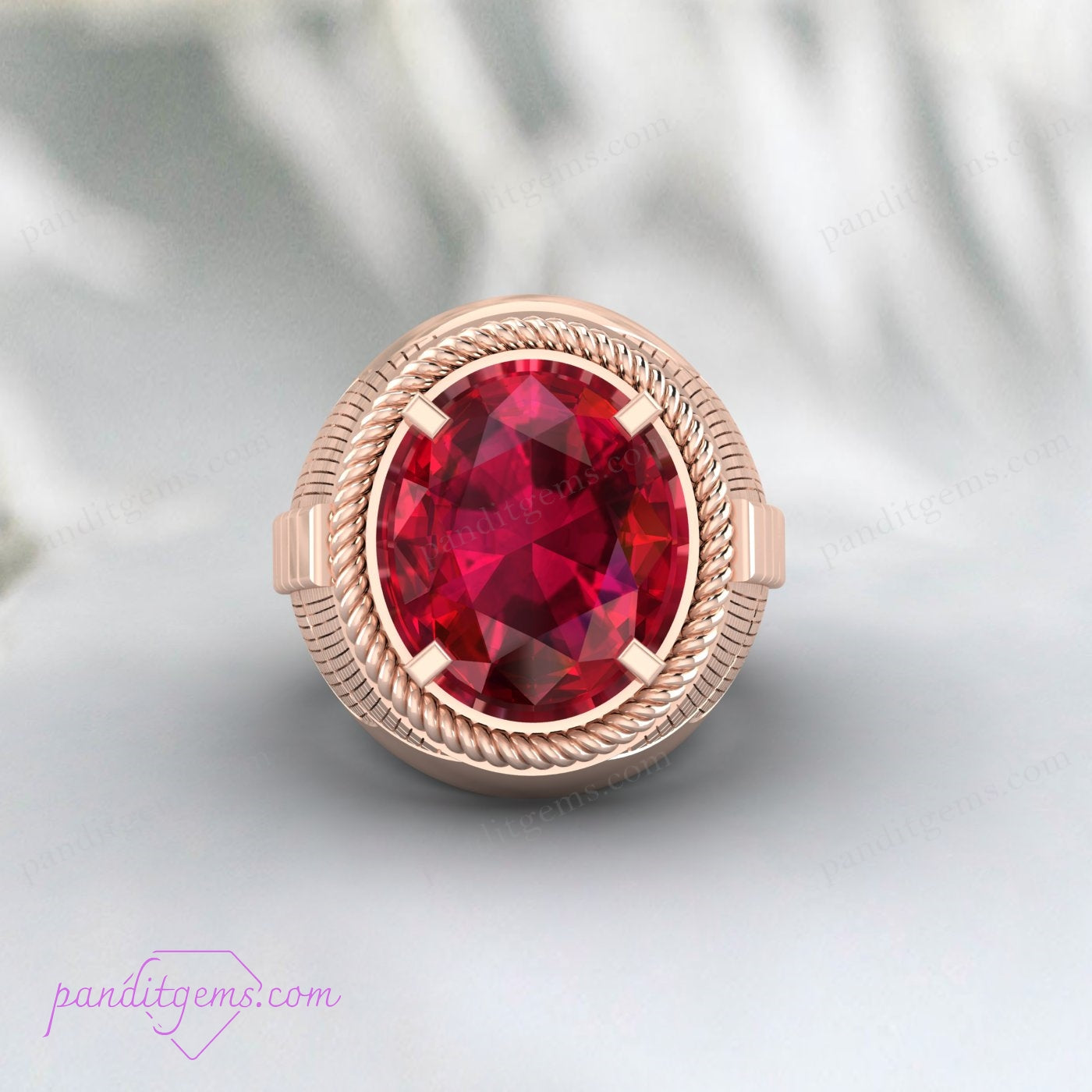 A unique men's ruby ring with an intricate silver band.