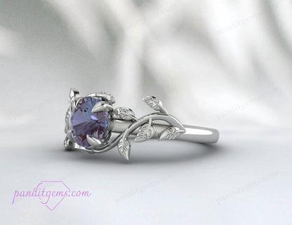 A sterling silver ring with a vine leaf design and a central Alexandrite stone.