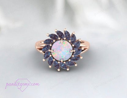 Vintage-style Alexandrite and Opal engagement ring with a radiant opal center stone and a halo of Alexandrite.