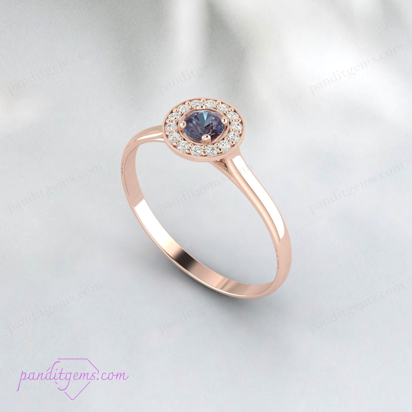 A vintage-inspired engagement ring featuring Alexandrite with a surrounding halo in rose gold.