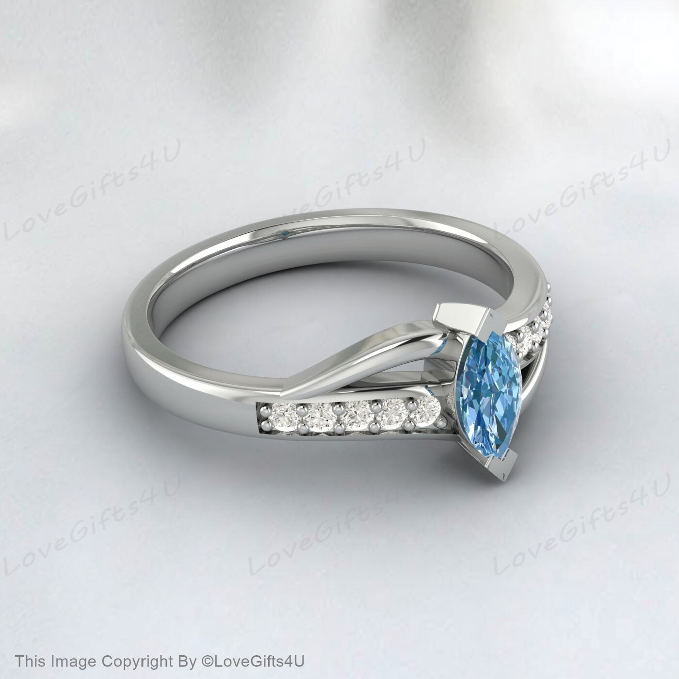 Bague de fiançailles en argent vermeil avec topaze bleu ciel taille marquise