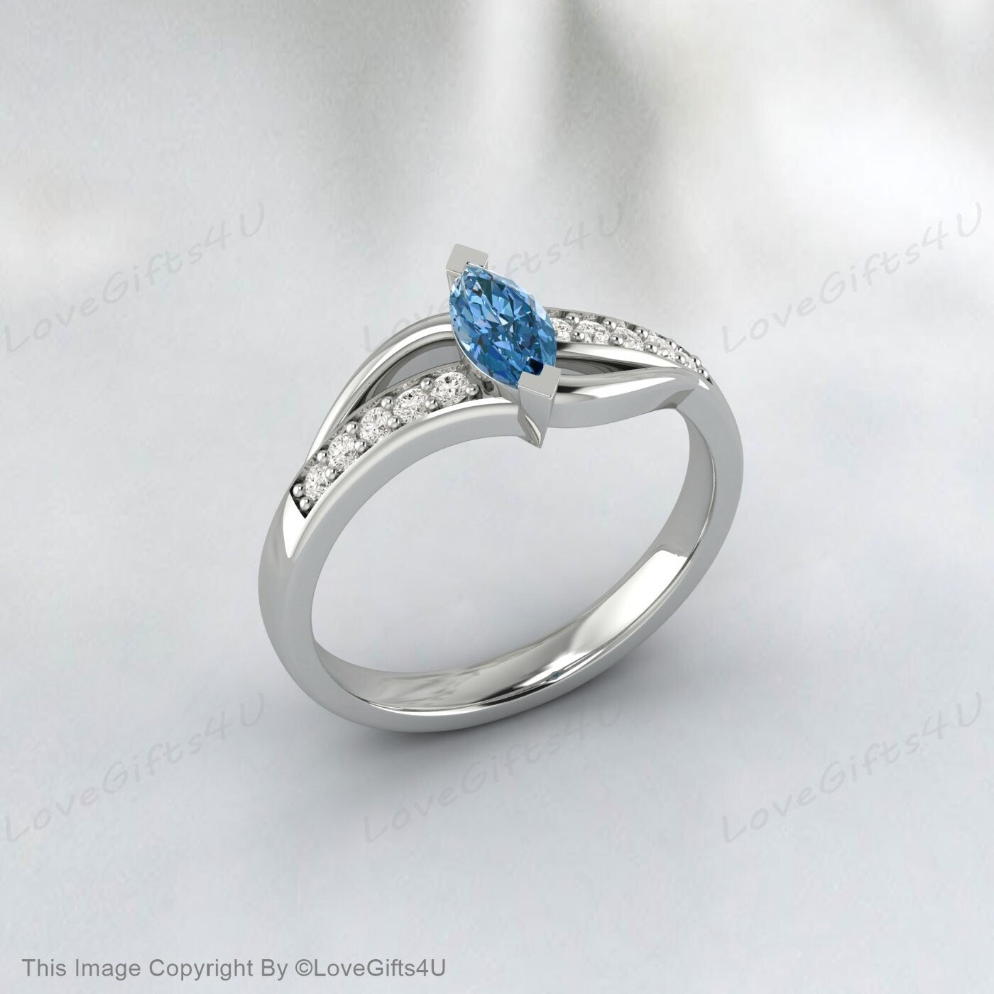 Bague de fiançailles en argent vermeil avec topaze bleu ciel taille marquise