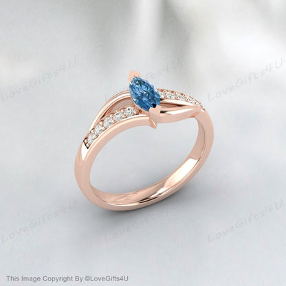 Bague de fiançailles en argent vermeil avec topaze bleu ciel taille marquise