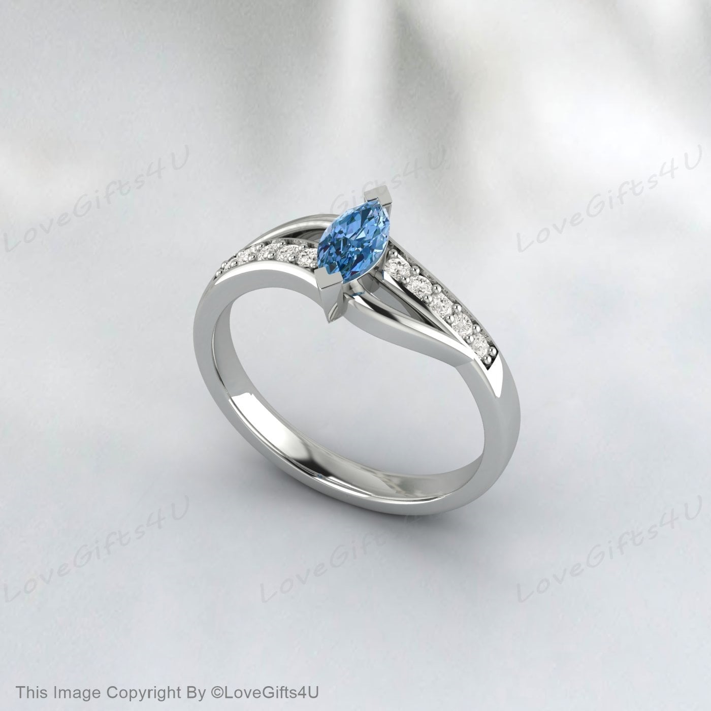 Bague de fiançailles en argent vermeil avec topaze bleu ciel taille marquise